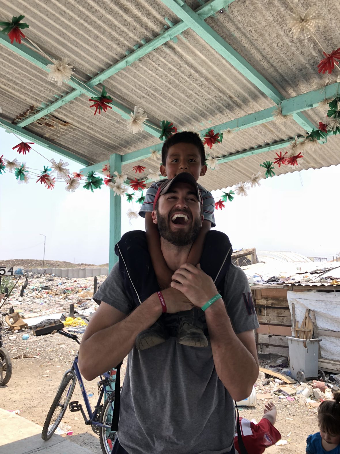 True Joy: Joey Rice playing with a child who lives at one of the Mexico City trash dumps during a trip with Fr. Rob in April 2018.